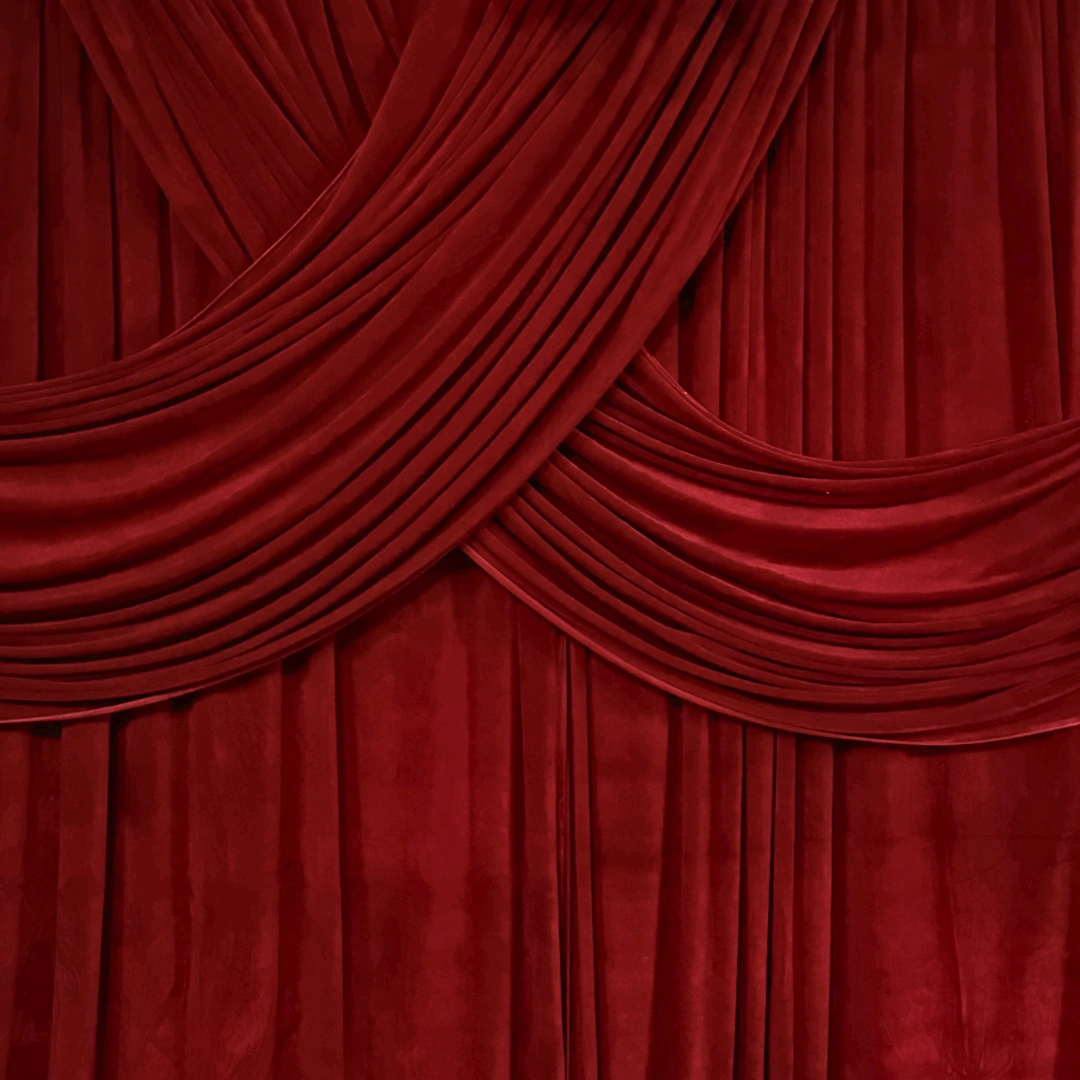 Maroon draped backdrop - The Booth District