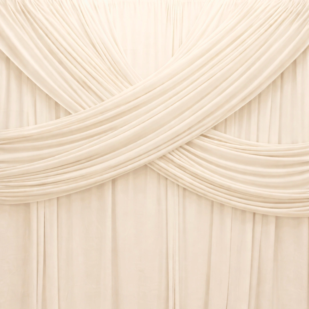 Ivory draped backdrop - The Booth District