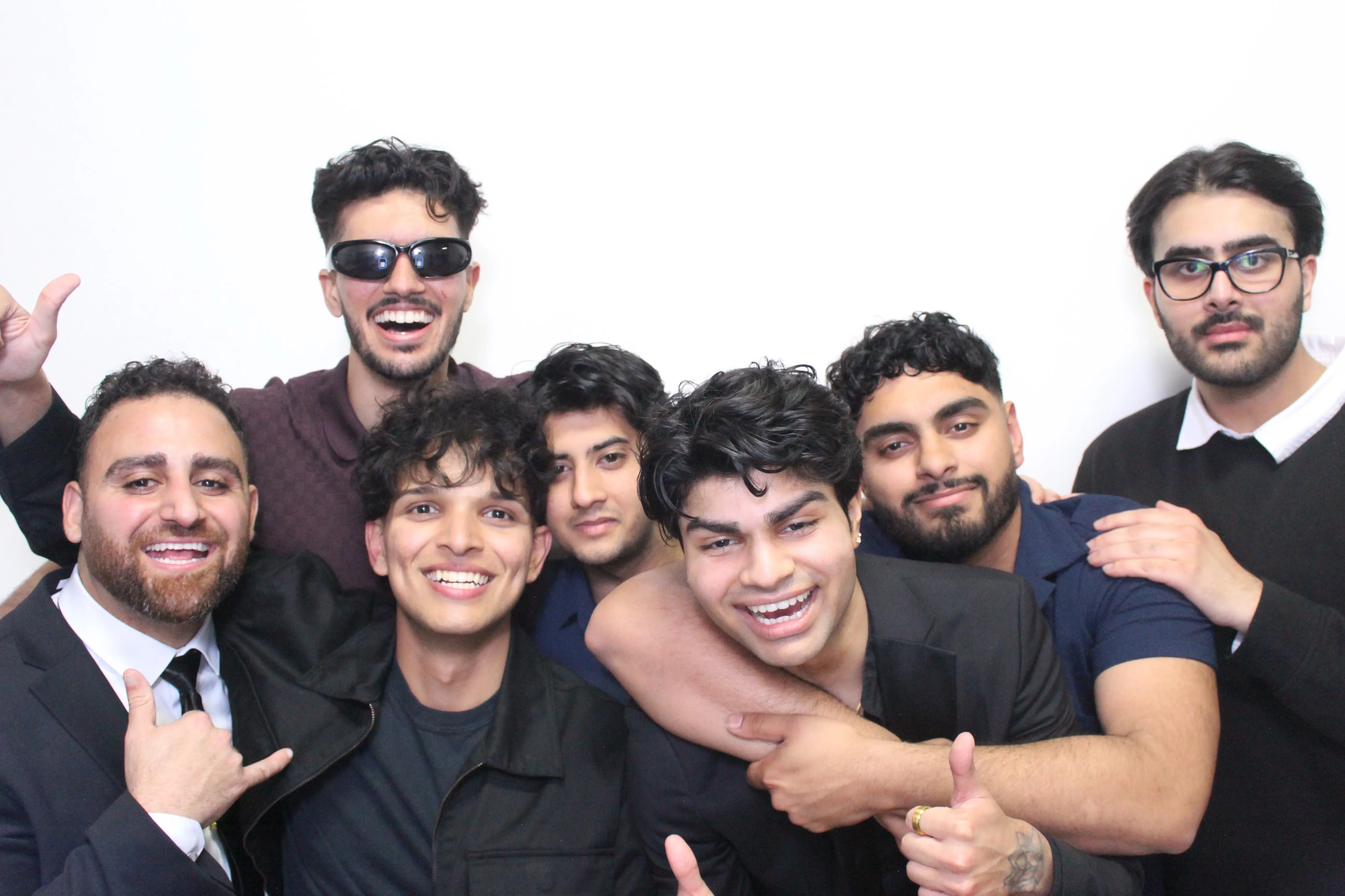 Large group of men celebrating at a photo booth event in Mississauga - The Booth District